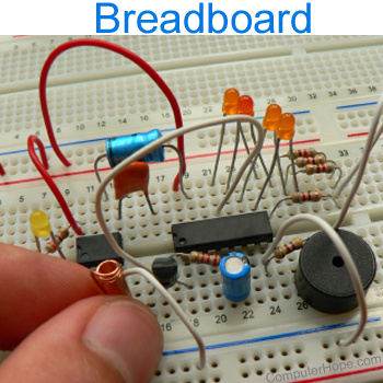 Breadboard with wires, capacitors, and integrated circuits