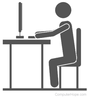 Illustrated person sitting at a desk, using a computer.